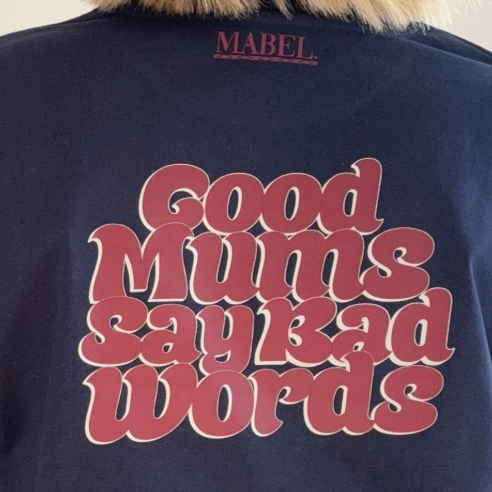 Navy sweatshirt with red text 'Good Mums Say Bad Words' and brand name 'MABEL' on a white background
