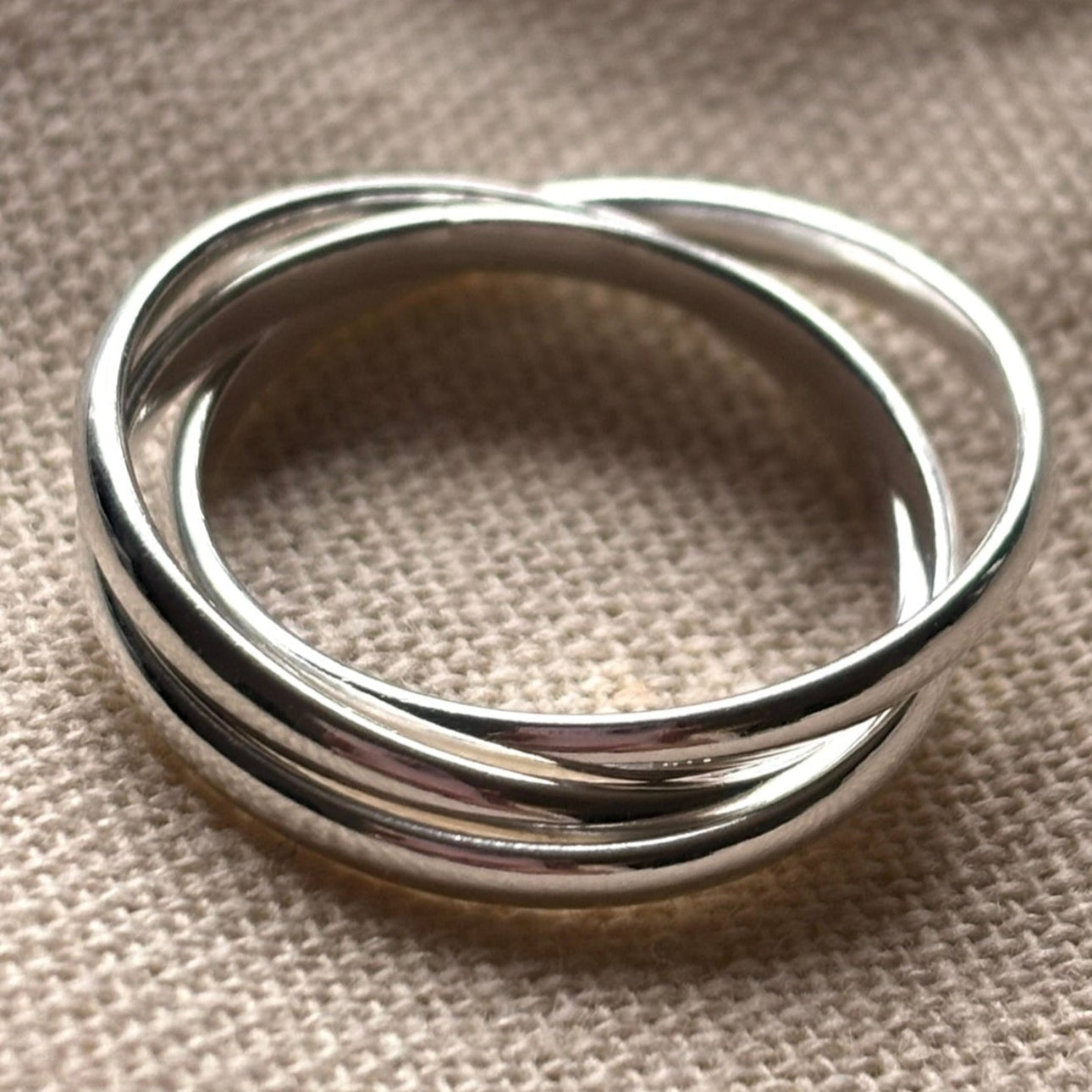 Silver triple lock fidget ring.