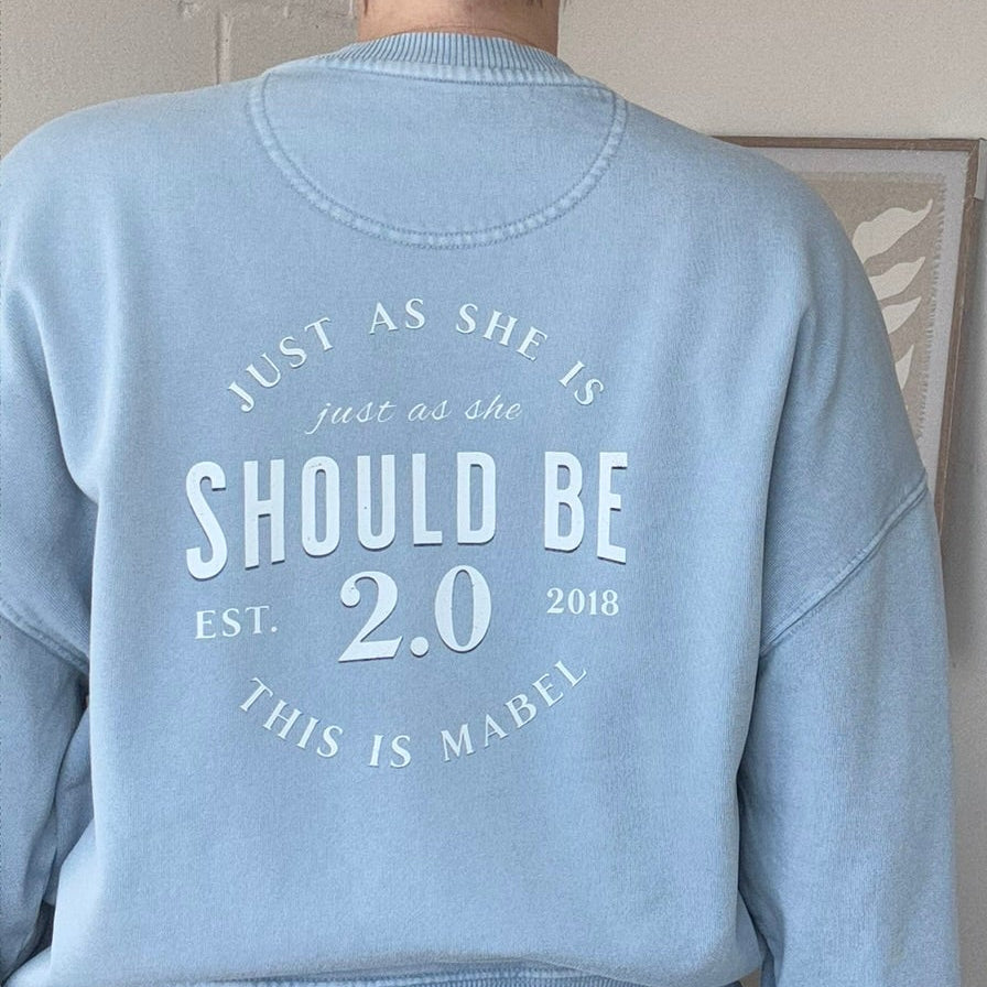 this is mabel, vitage wash Light blue sweatshirt just as she is just as should be pattern on back