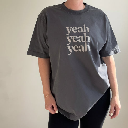 this is mabel vintage  grey oversized t-shirt with 'yeah yeah yeah' text against a plain background