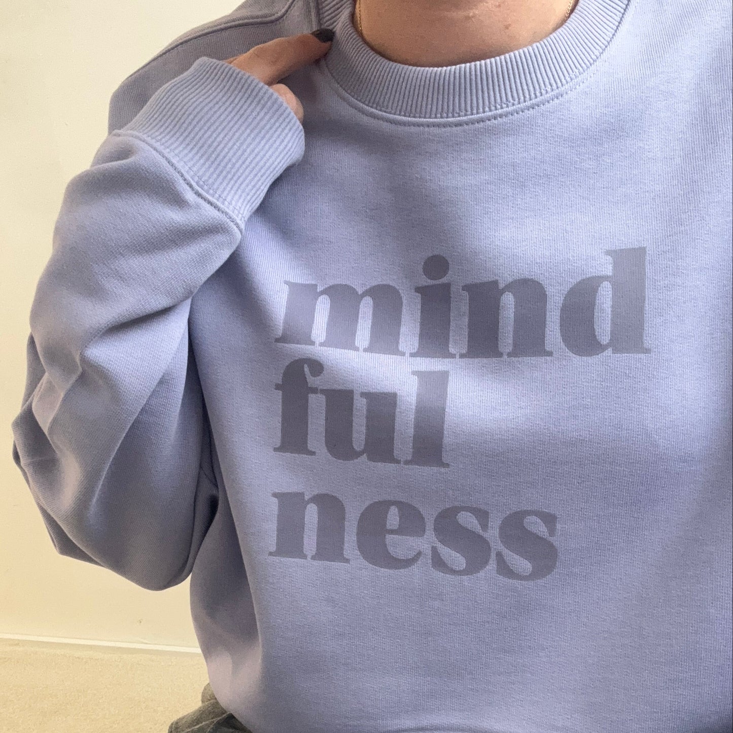 Violet oversized this is mabel sweatshirt with 'mindfulness' text worn by a person on a light background